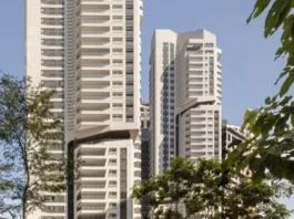 Rascacielos residenciales EZ Parque da Cidade en São Paulo, vistas entre árboles.