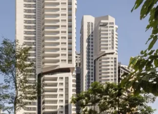 Rascacielos residenciales EZ Parque da Cidade en São Paulo, vistas entre árboles.